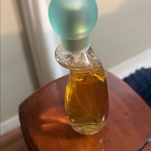 Elegant Perfume Bottle with Blue Cap used a little sprays out of this